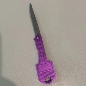 petit couteau en forme de clé violet
